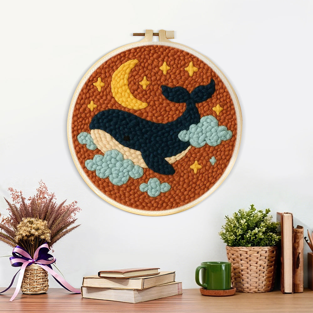 Finished starry whale artwork displayed on a wall