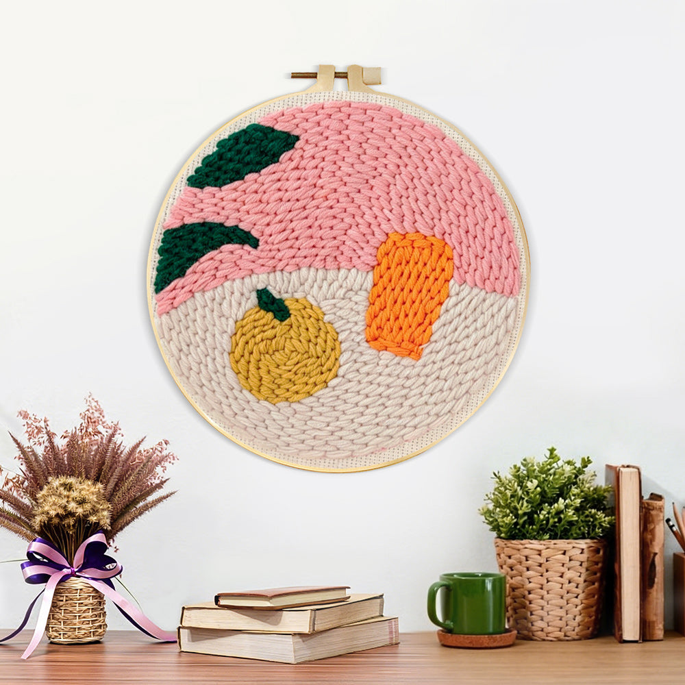 Finished still life fruit and object artwork displayed on a wall