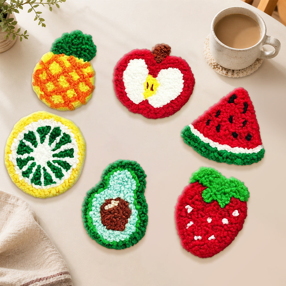 Strawberry, avocado and pineapple punch needle coasters used for home decoration