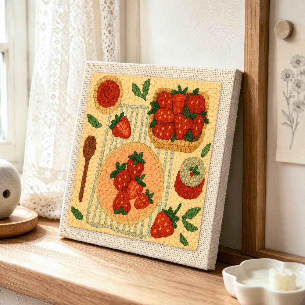 Strawberry dessert collection punch needle artwork displayed on a table