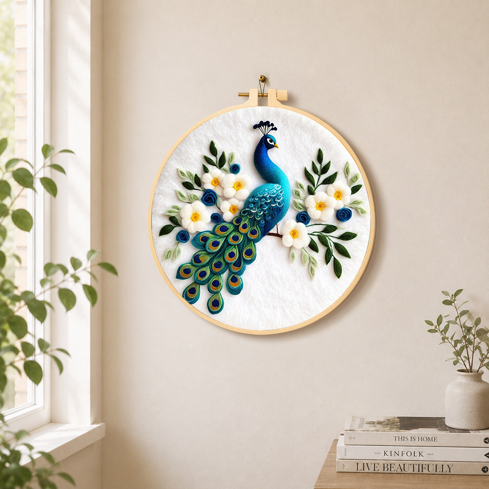 Stunning peacock with white flowers needle felt wall art displayed in a bright home interior