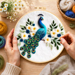 Creating the stunning peacock with white flowers wool painting by hand with a felting needle