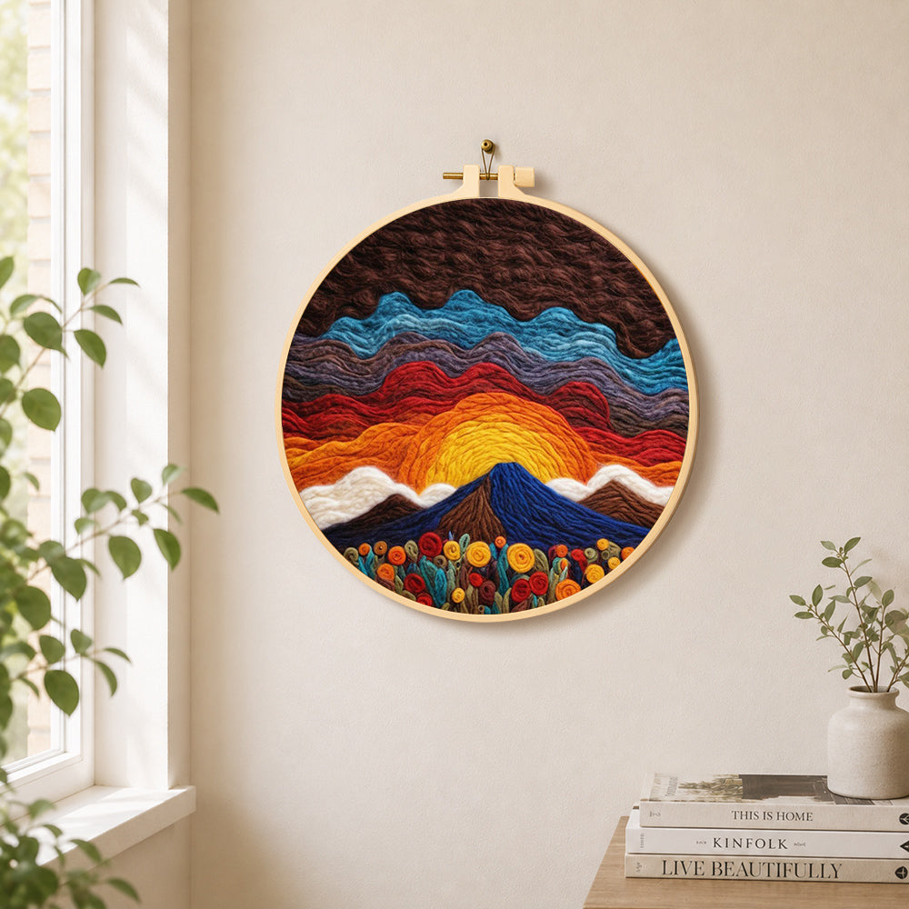 Stunning sunrise over wavy hills needle felt wall art displayed in a bright home interior
