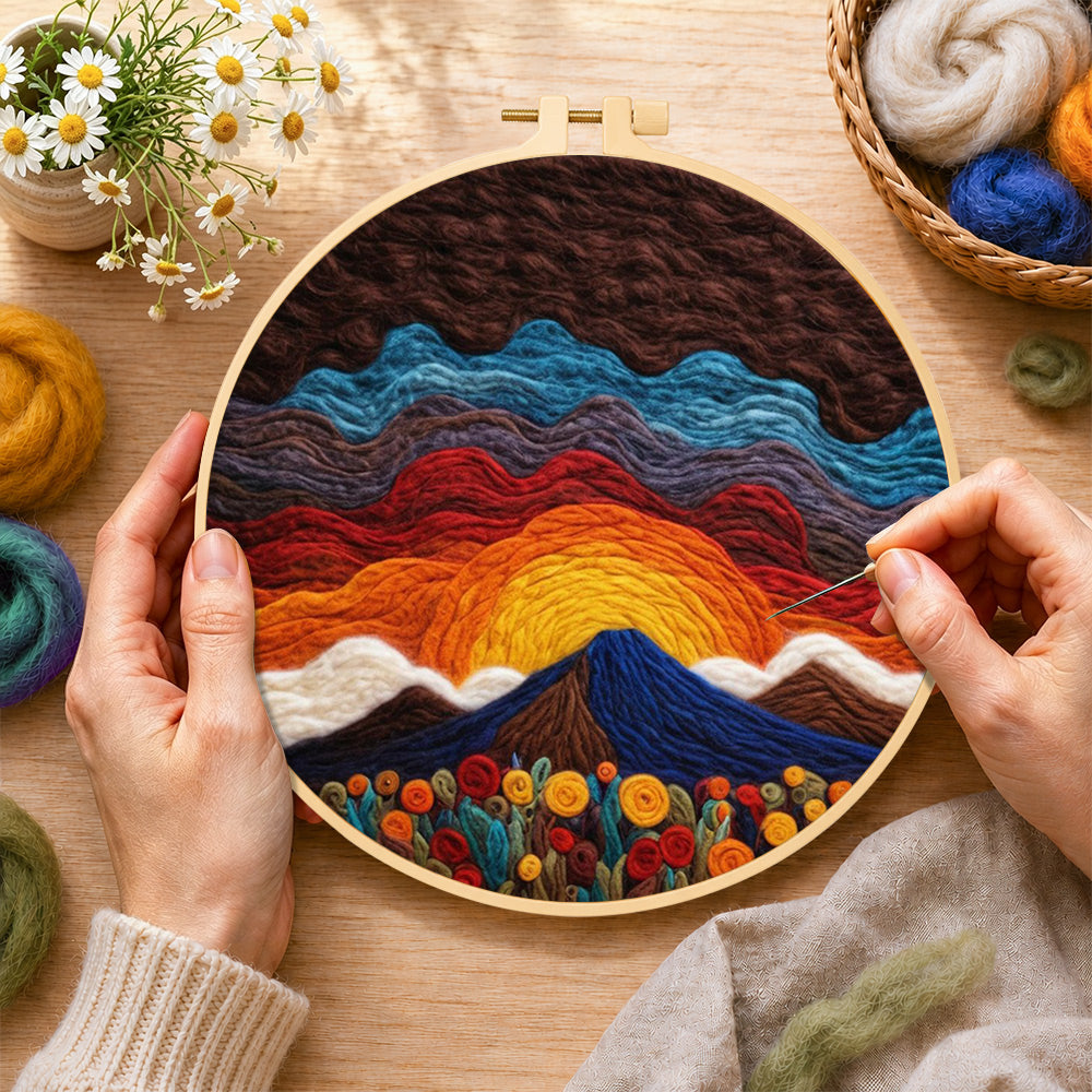 Creating the stunning sunrise over wavy hills wool painting by hand with a felting needle