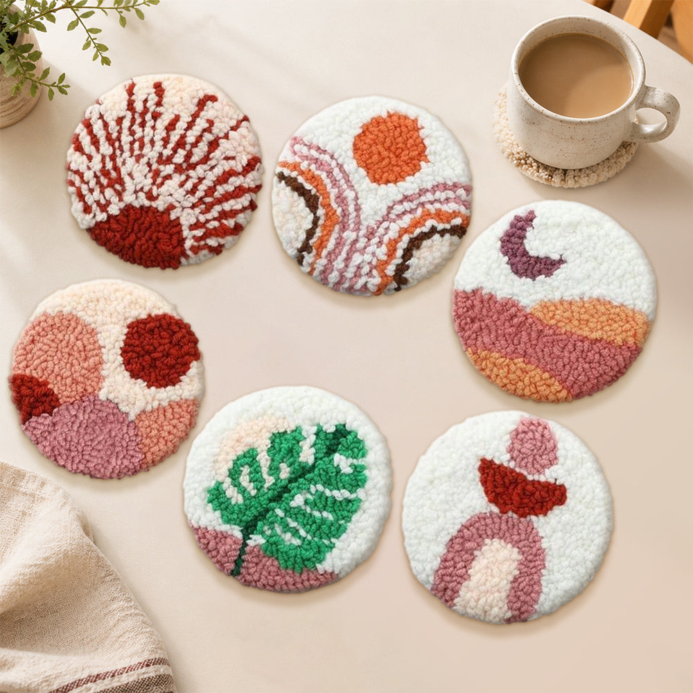 Stunning sunset and green leaf punch needle coasters used for home decoration