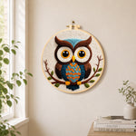 Stylish blue and orange owl needle felt wall art displayed in a bright home interior