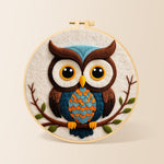 Stylish blue and orange owl needle felting kit for beginners with a round wooden frame