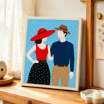 Stylish couple in hats punch needle artwork displayed on a table