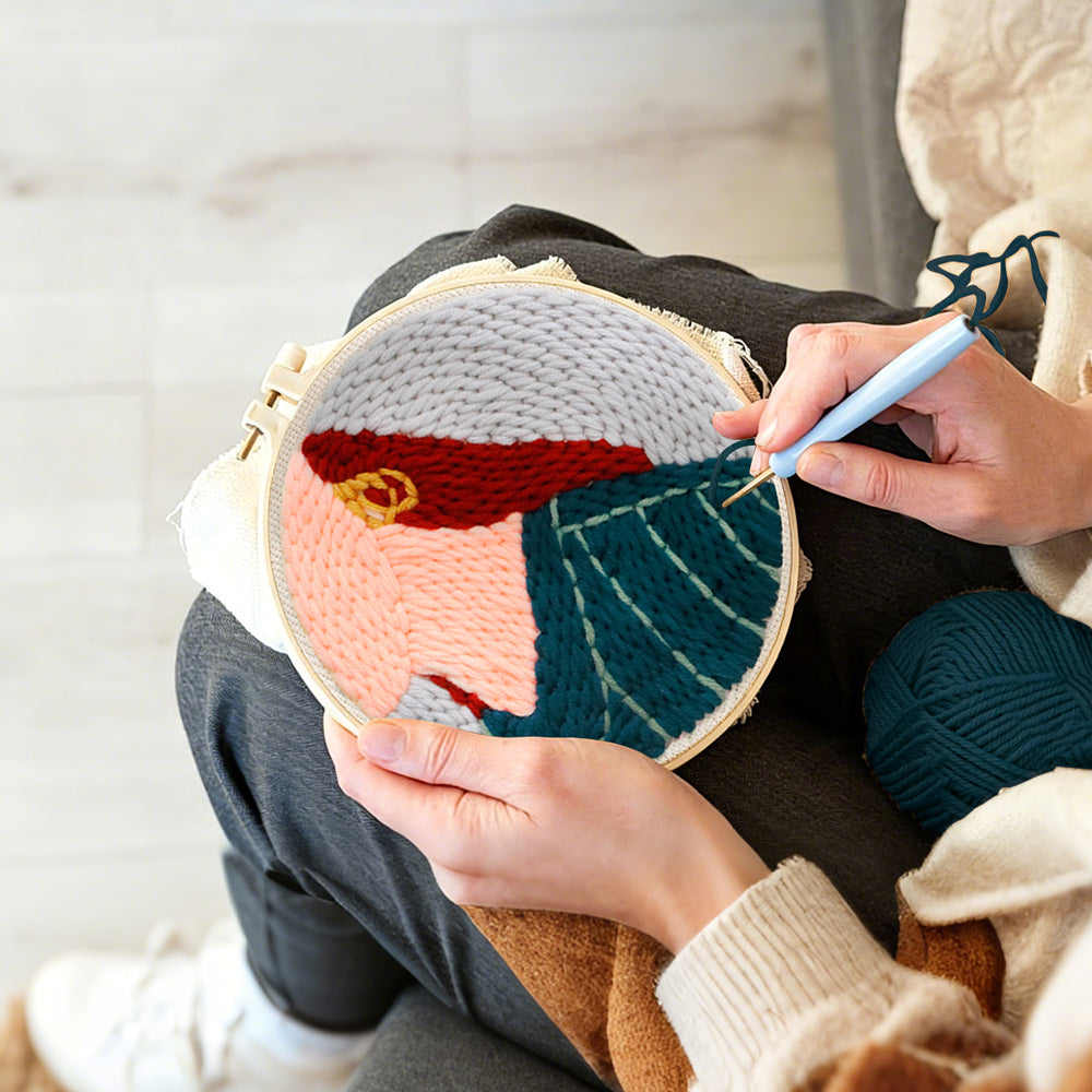 Creating handmade stylish red-haired lady punch needle artwork