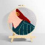 Stylish red-haired lady punch needle kit for beginners