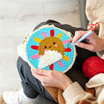Creating handmade sun and cloud with rainbow rays punch needle artwork
