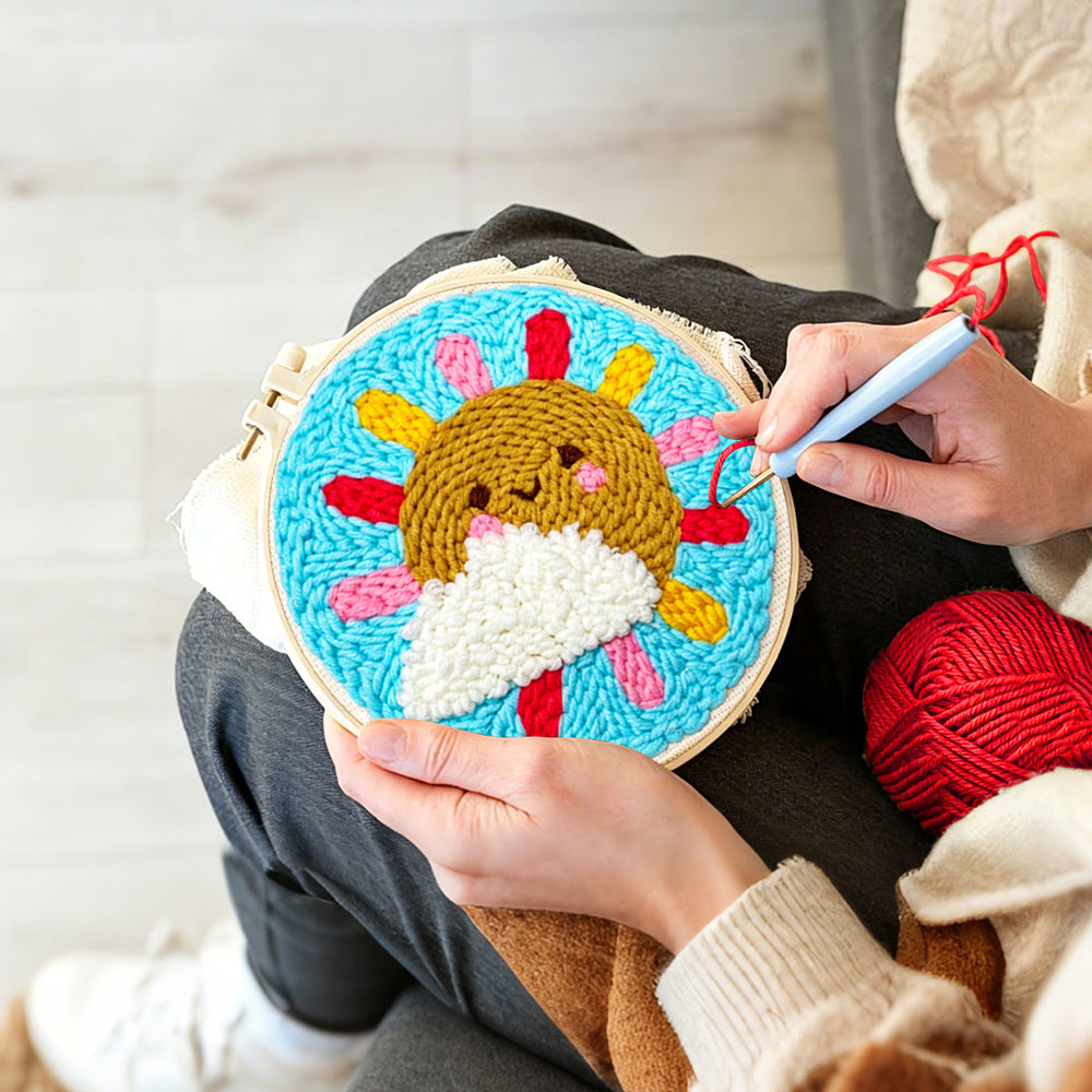 Creating handmade sun and cloud with rainbow rays punch needle artwork