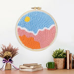 Finished sun over colourful clouds artwork displayed on a wall