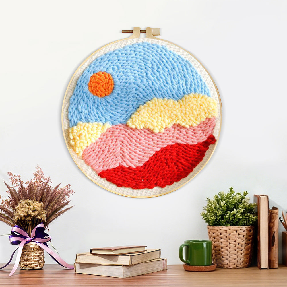 Finished sun over colourful mountains and clouds artwork displayed on a wall