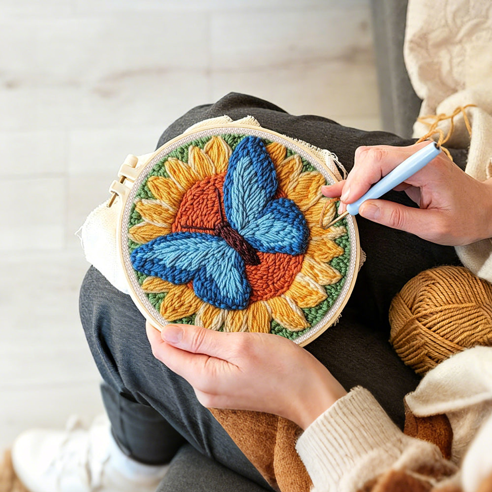Creating handmade sunflower and blue butterfly punch needle artwork