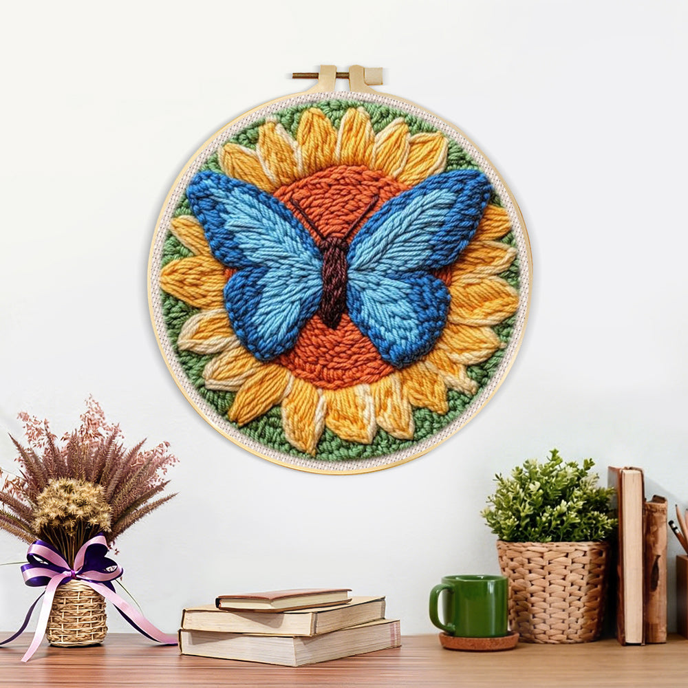 Finished sunflower and blue butterfly artwork displayed on a wall