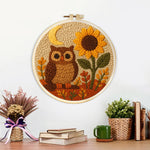 Finished sunflower owl artwork displayed on a wall