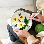 Creating handmade sunflowers and buzzing bee punch needle artwork