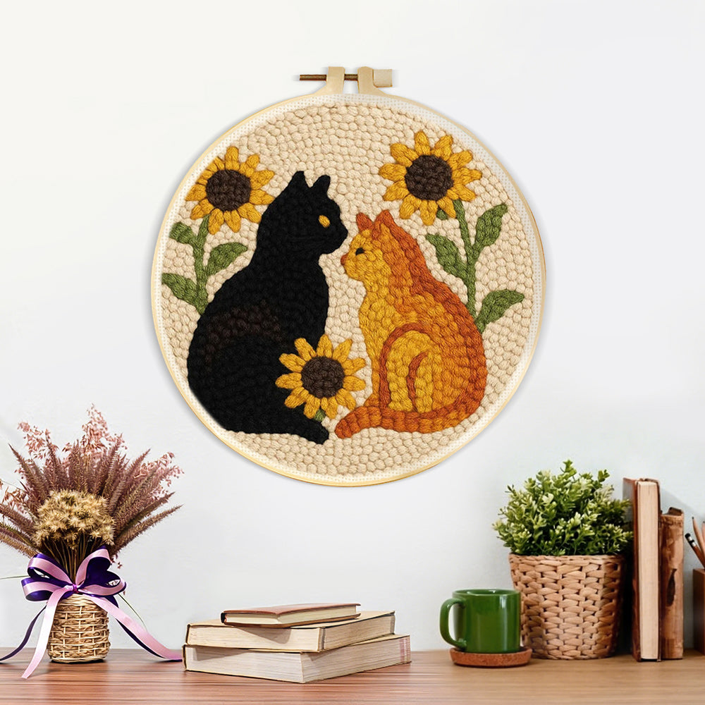 Finished sunflowers and cats artwork displayed on a wall