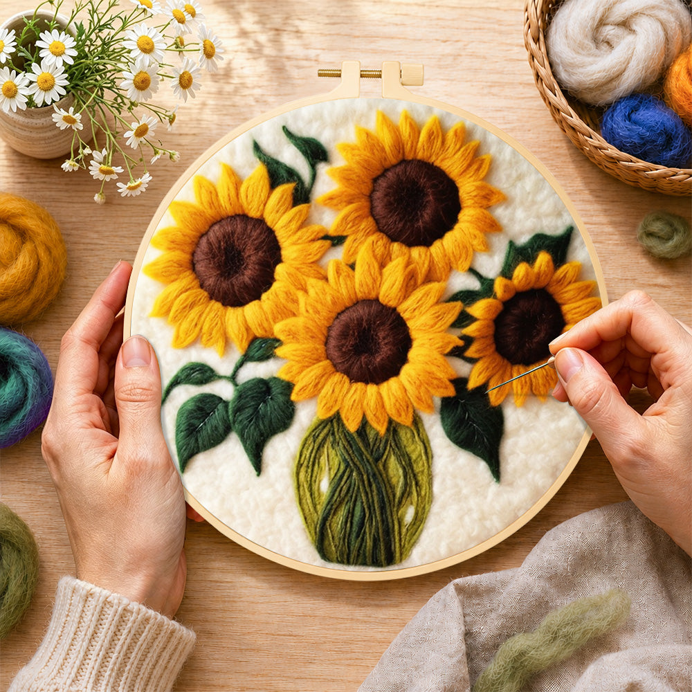 Creating the sunflowers in a green vase wool painting by hand with a felting needle