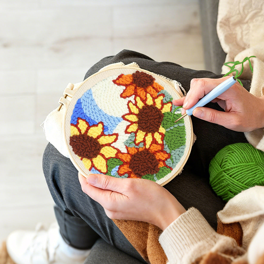 Creating handmade sunflowers under blue sky punch needle artwork