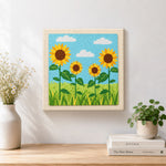 Finished sunflowers under the sky artwork displayed on a wall