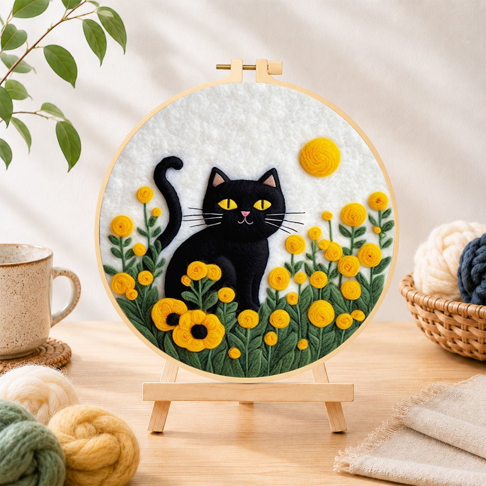 Finished sunny black cat in yellow flowers needle felting displayed on a wooden easel