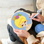 Creating handmade sunny blonde girl punch needle artwork