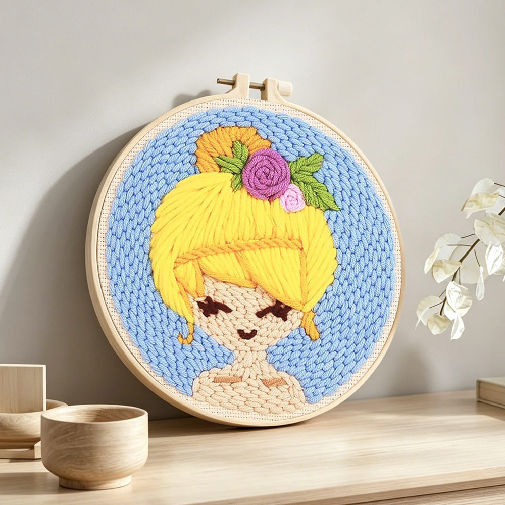 Sunny blonde girl punch needle artwork displayed on a table