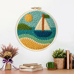 Finished sunny sailboat on blue waves artwork displayed on a wall