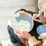 Creating handmade sunny sky with clouds punch needle artwork