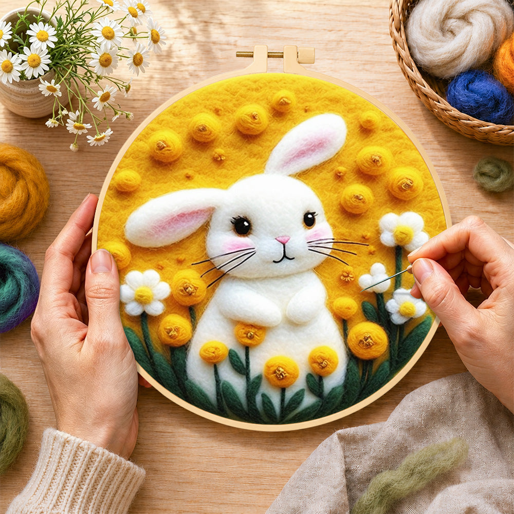 Creating the sunny white bunny and yellow flowers wool painting by hand with a felting needle