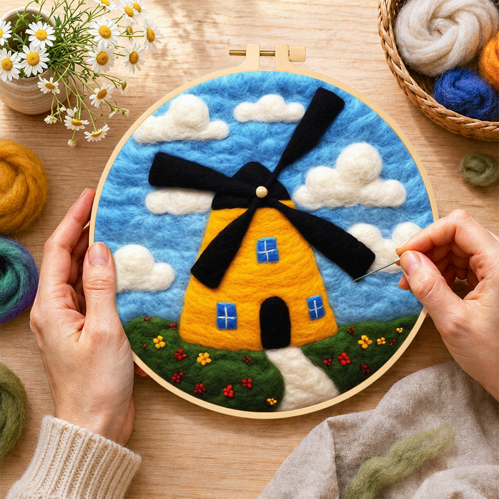 Creating the sunny yellow windmill wool painting by hand with a felting needle