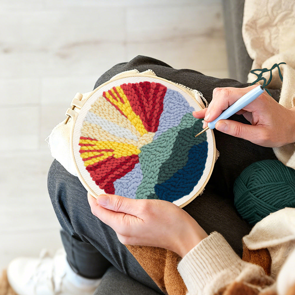 Creating handmade sunrise mountain landscape punch needle artwork