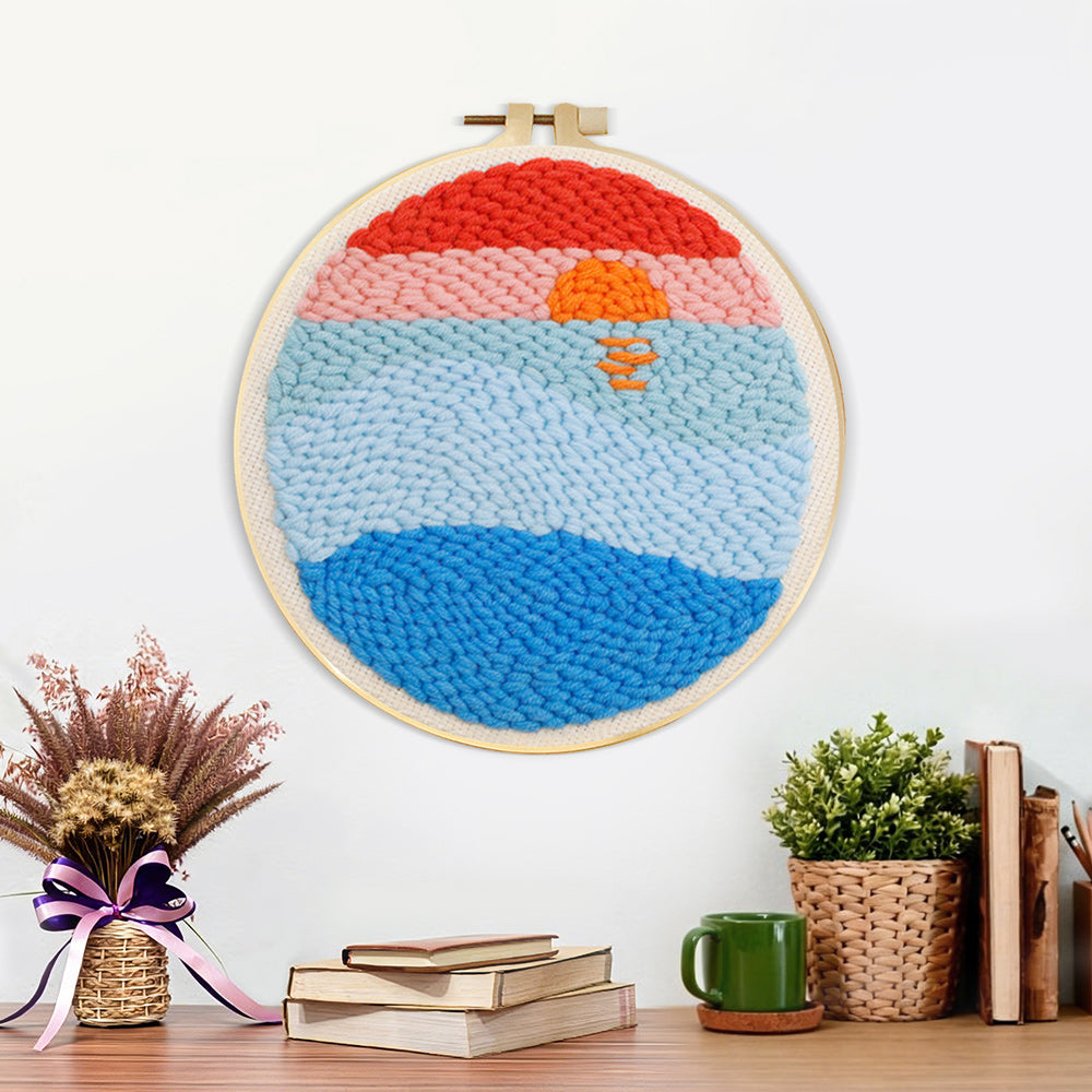 Finished sunrise over ocean artwork displayed on a wall