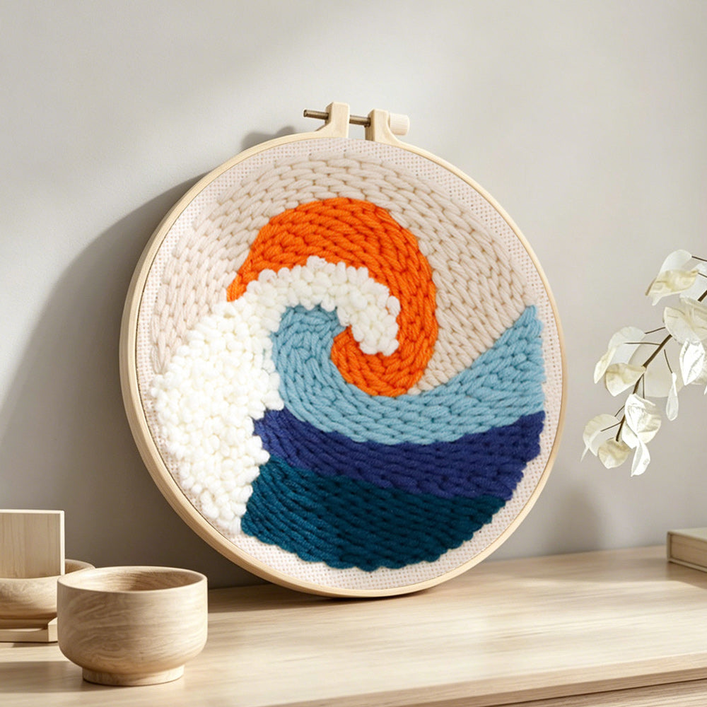 Sunrise waves punch needle artwork displayed on a table