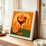 Sunset city cocktail punch needle artwork displayed on a table