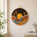 Sunset in the desert needle felt wall art displayed in a bright home interior