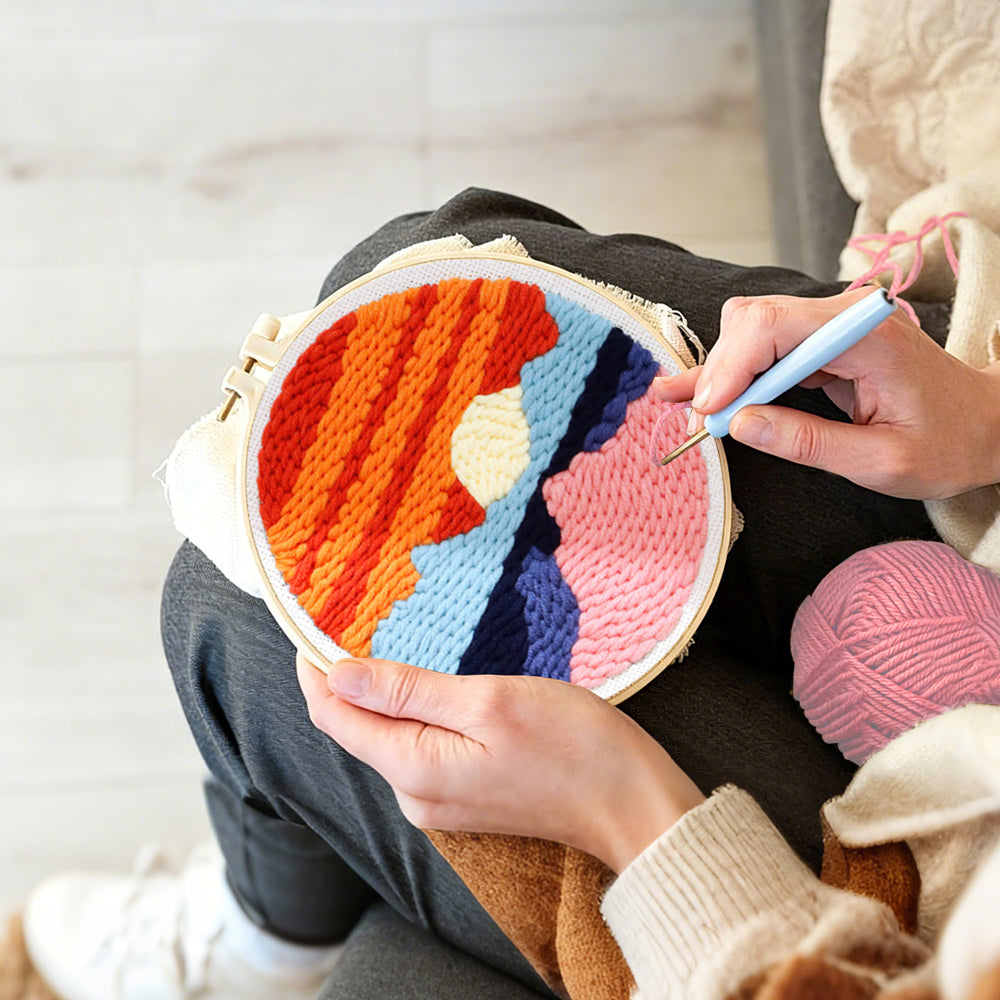 Creating handmade sunset over ocean punch needle artwork