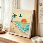 Sunset, palm tree and footprints punch needle artwork displayed on a table