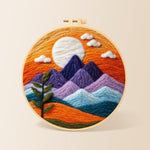 Sunset purple mountains and green sprig needle felting kit for beginners with a round wooden frame
