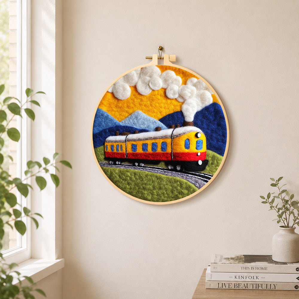Sunset steam train needle felt wall art displayed in a bright home interior