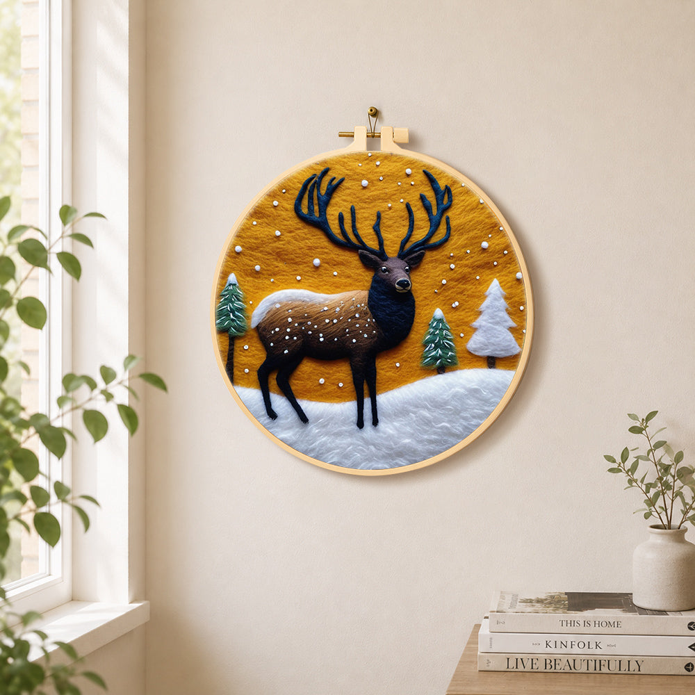 Sunset winter stag needle felt wall art displayed in a bright home interior
