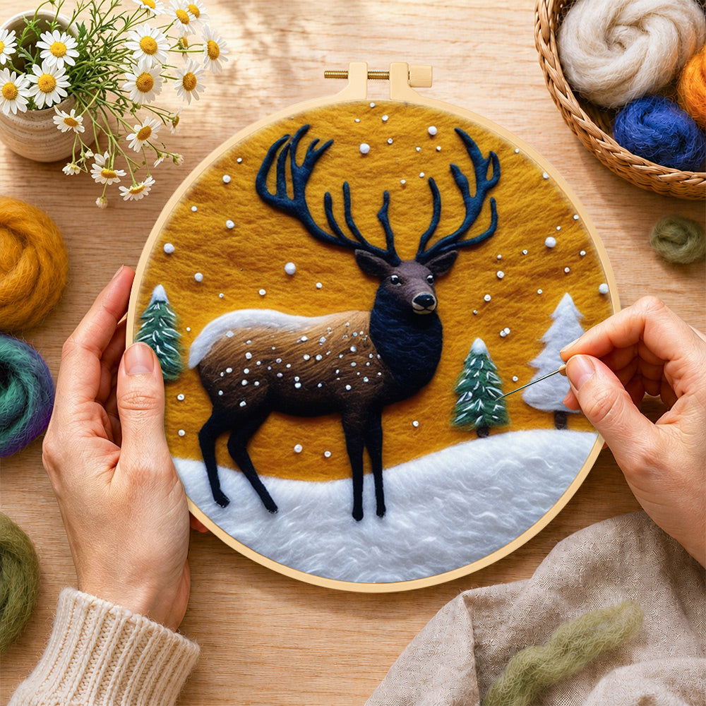 Creating the sunset winter stag wool painting by hand with a felting needle