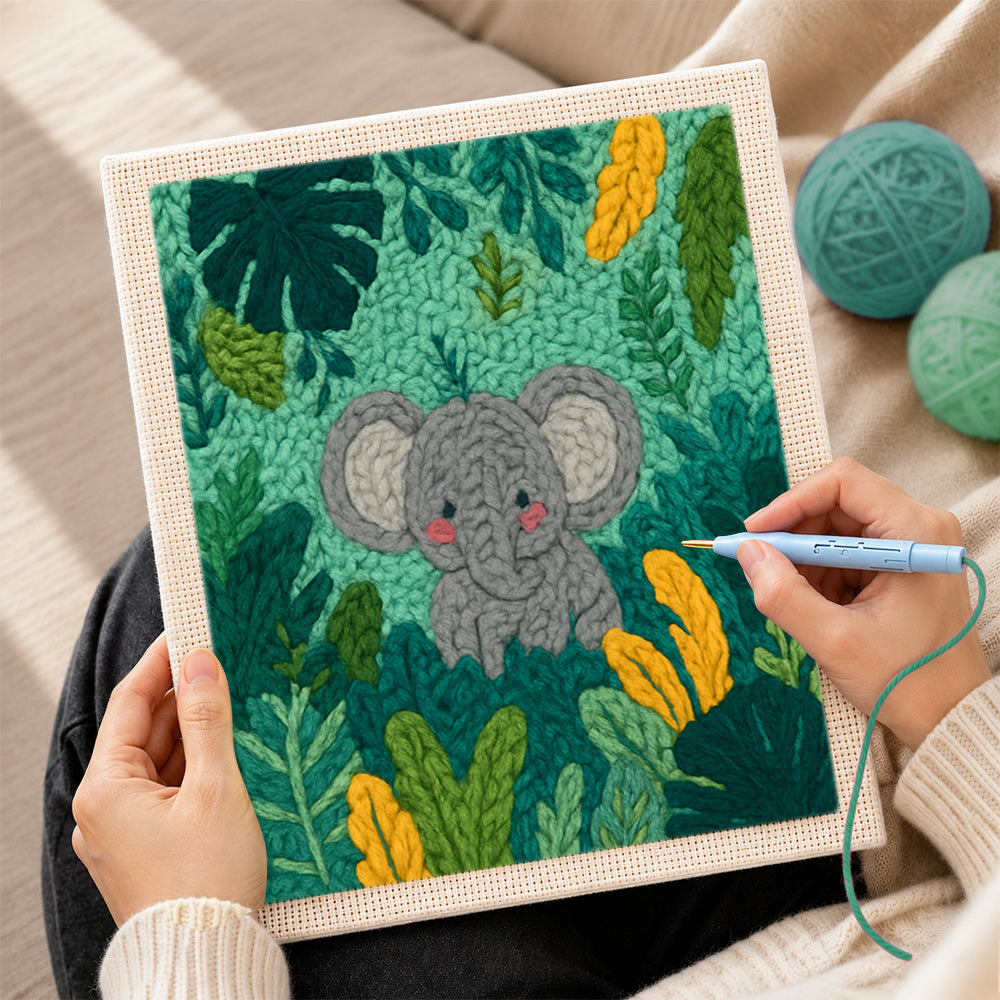 Creating handmade sweet baby elephant in tropical leaves punch needle artwork