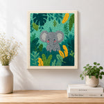 Finished sweet baby elephant in tropical leaves artwork displayed on a wall