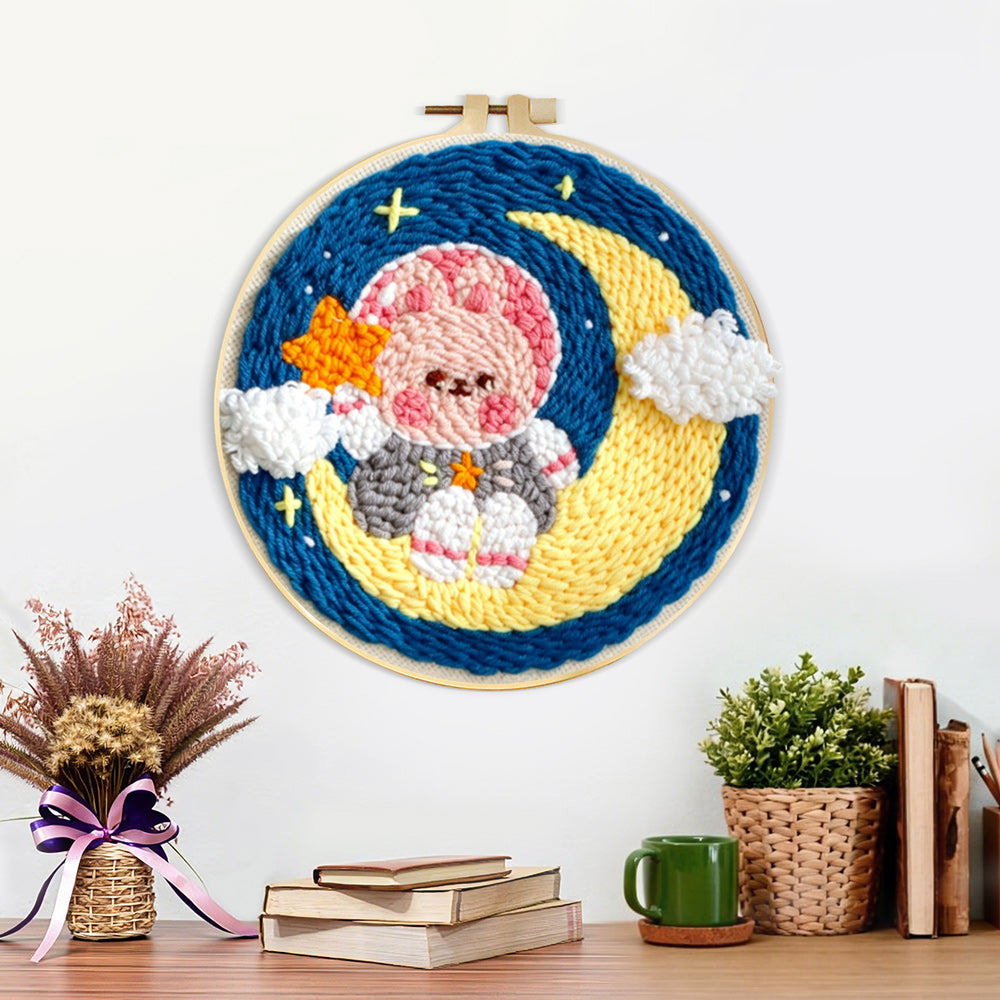 Finished sweet bunny on the moon artwork displayed on a wall