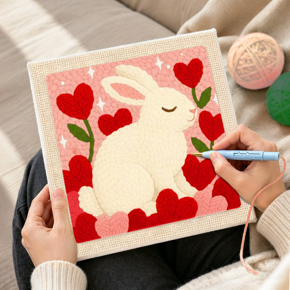 Creating handmade sweet bunny with flower hearts punch needle artwork