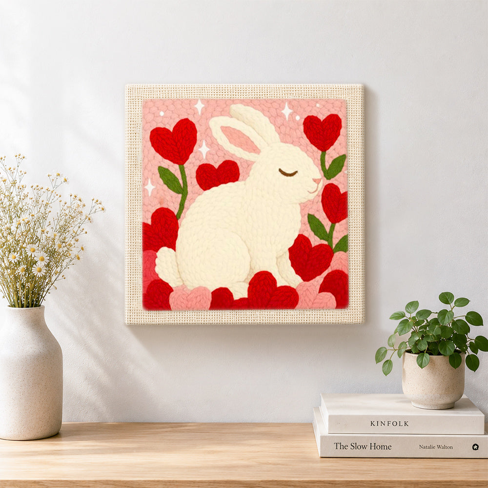 Finished sweet bunny with flower hearts artwork displayed on a wall