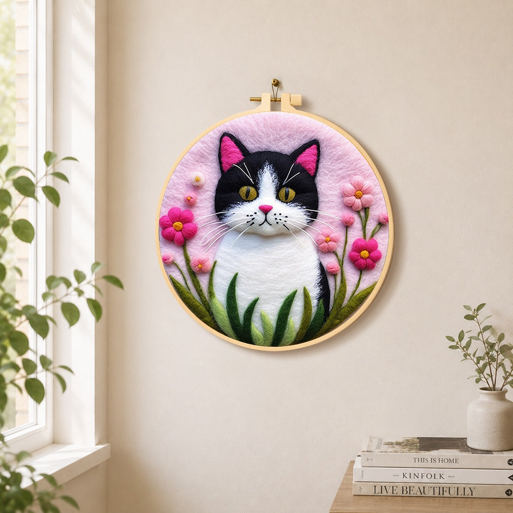 Sweet cat and vibrant pink flowers needle felt wall art displayed in a bright home interior